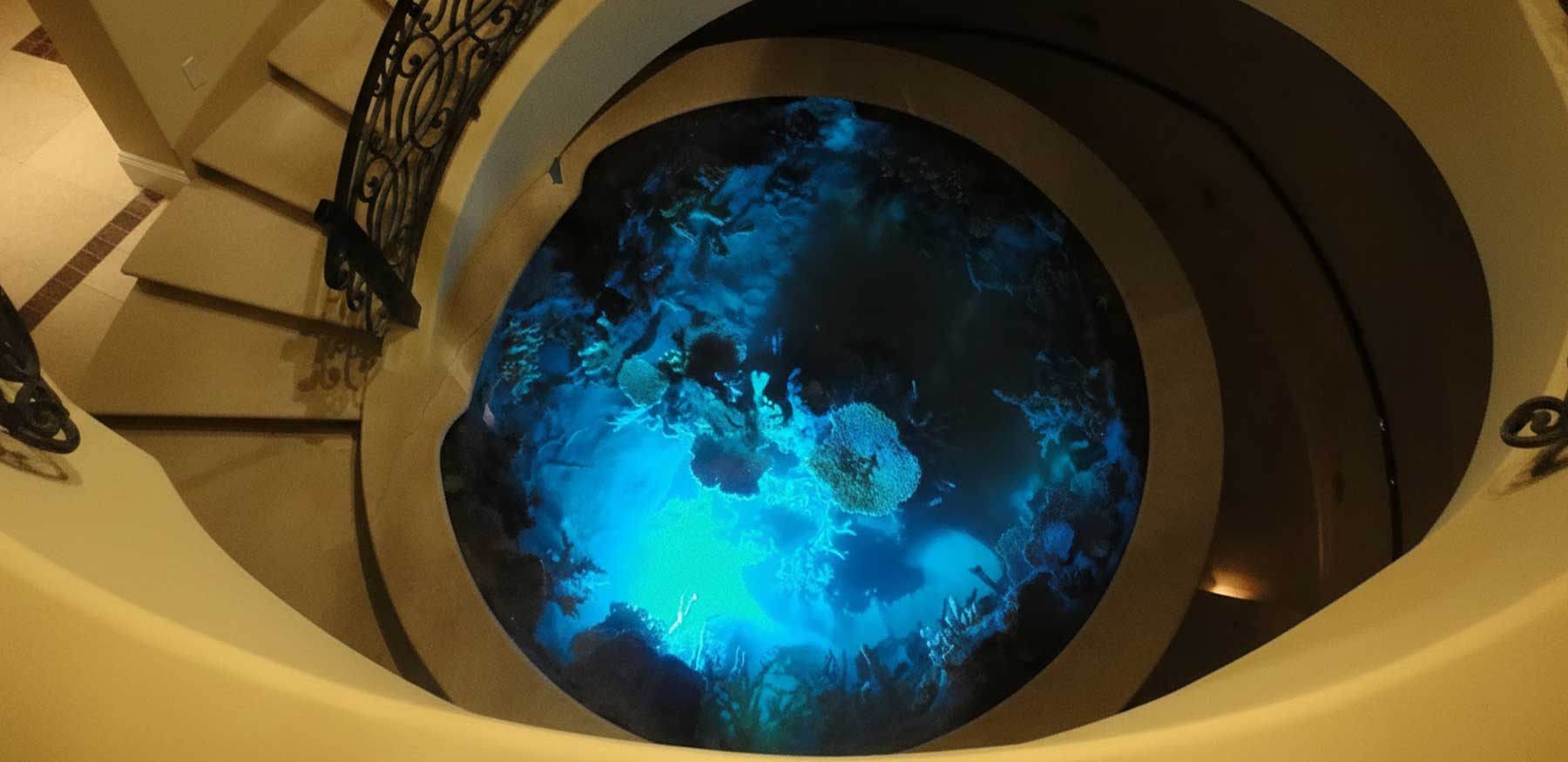 circular-aquarium-evening-blue-LED-lighting-spiral-staircase